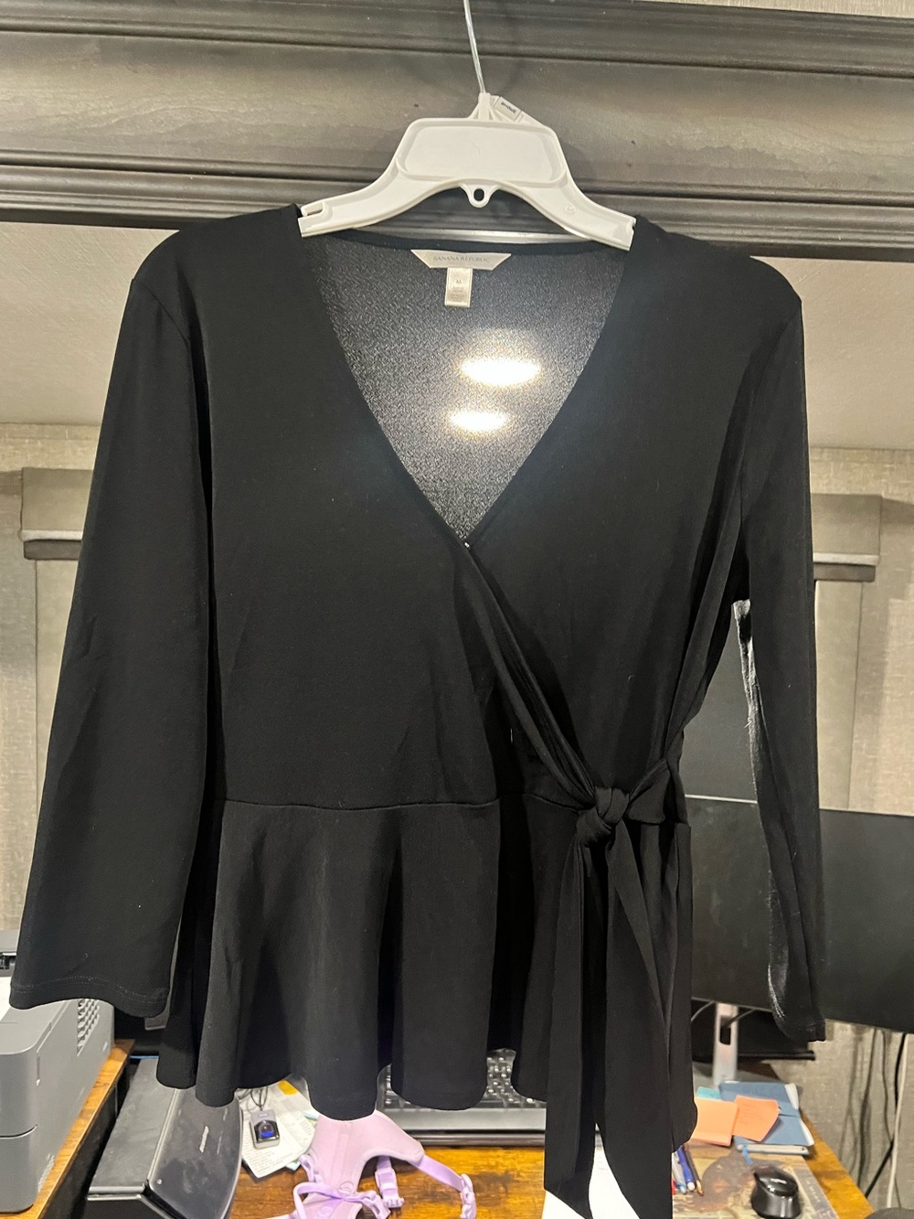 Banana Republic Black Long-Sleeve Wrap Peplum blouse with a faux tie at the wais